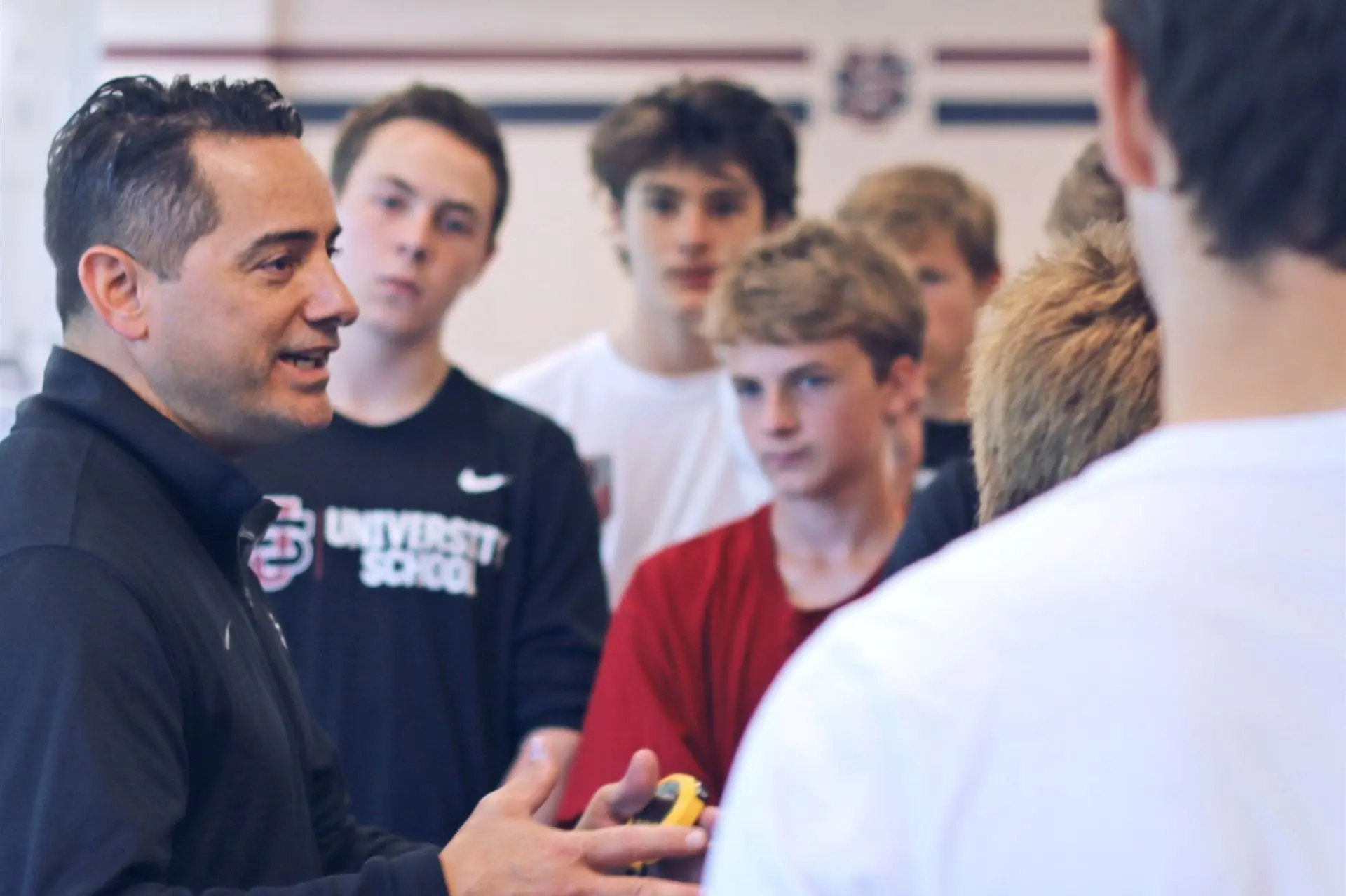 Carlo Alvarez talking to a group of University School students.