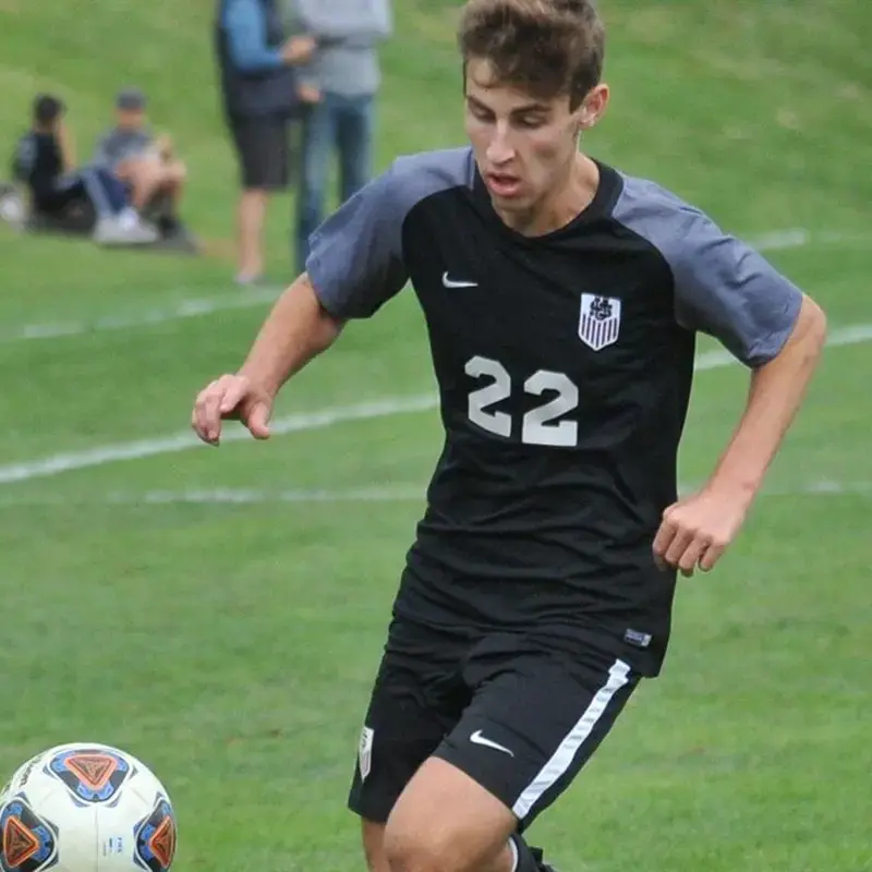 University School student playing Soccer.