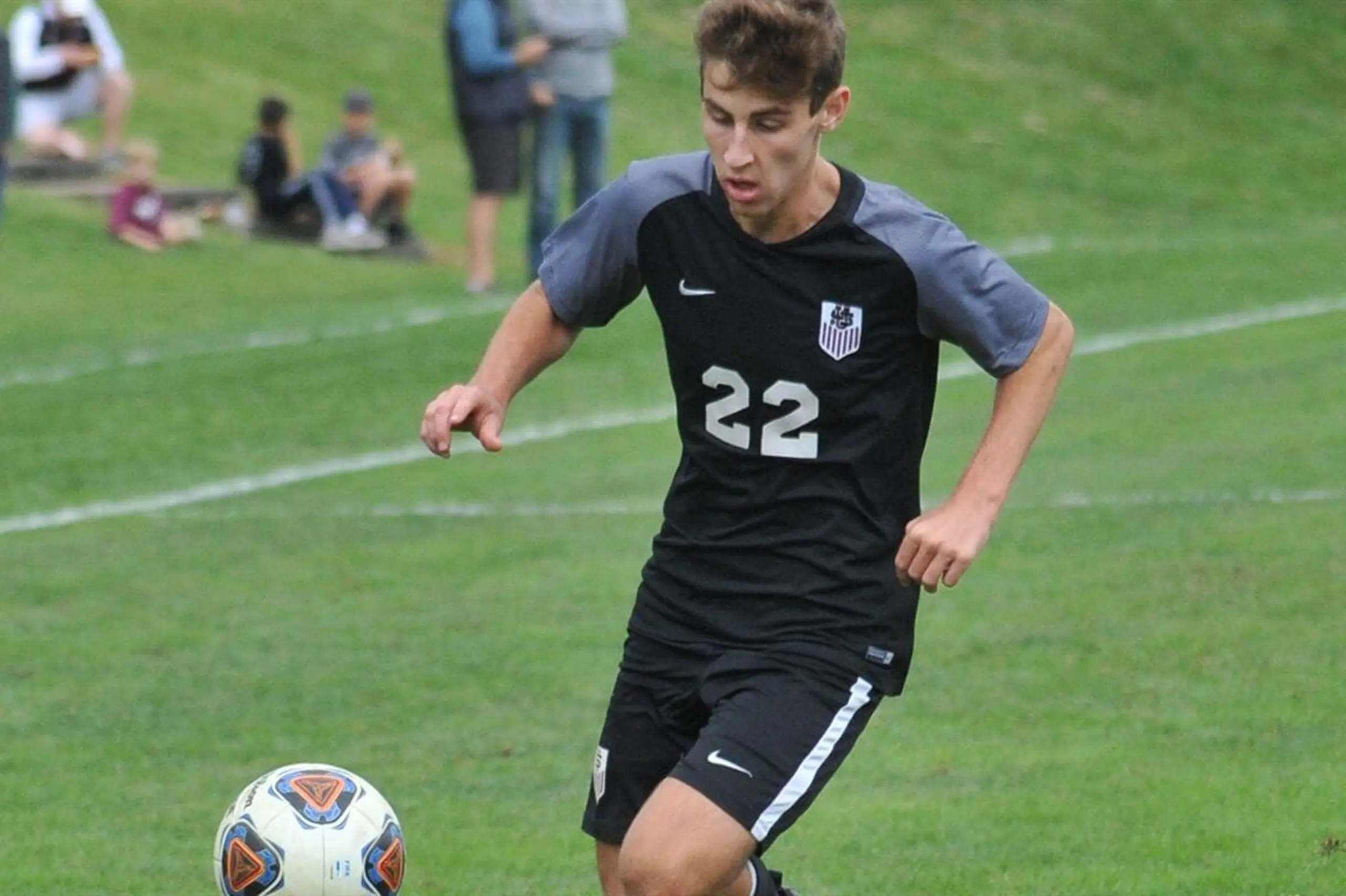 University School student playing Soccer.