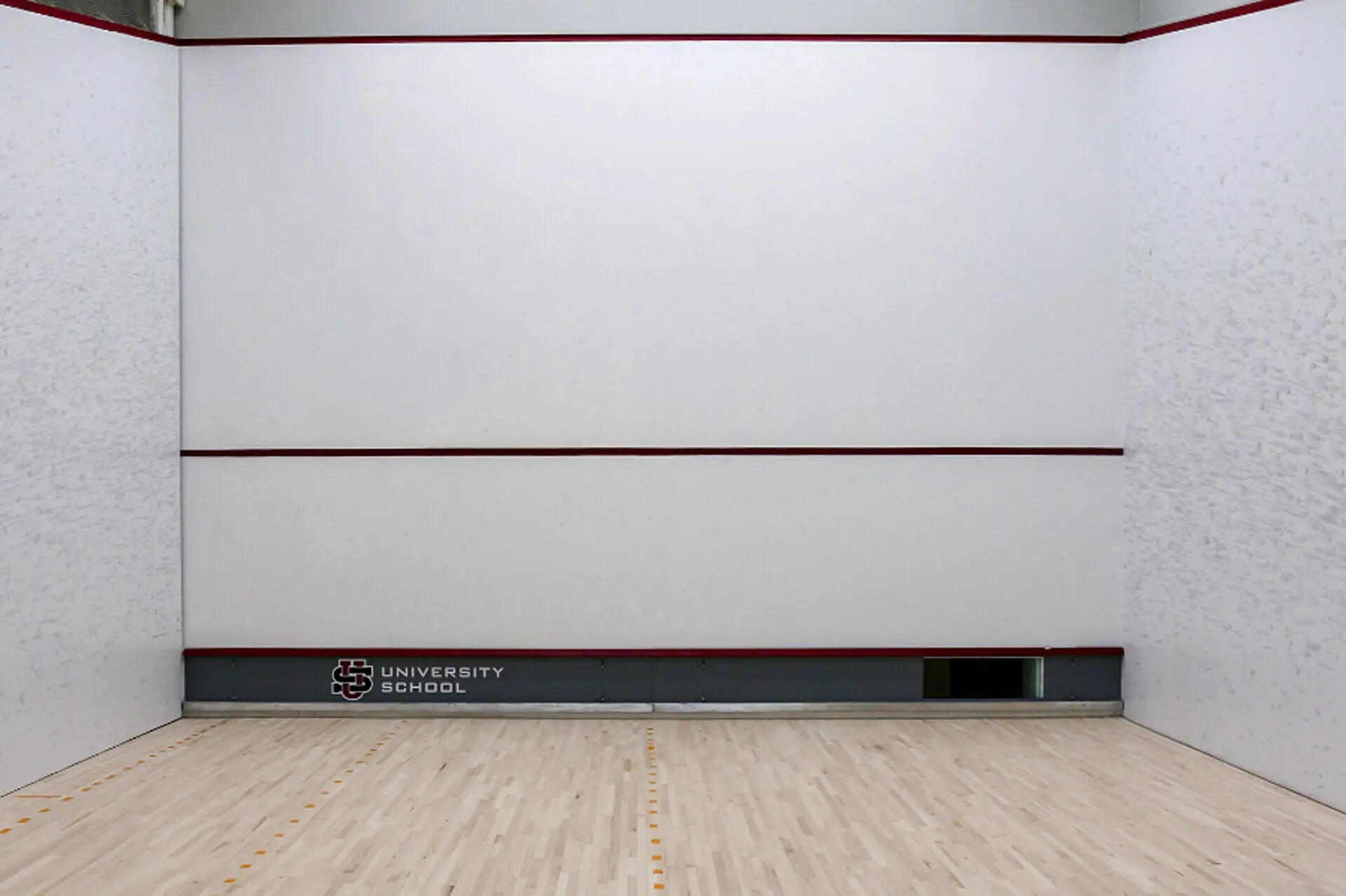 A white squash court at University School.