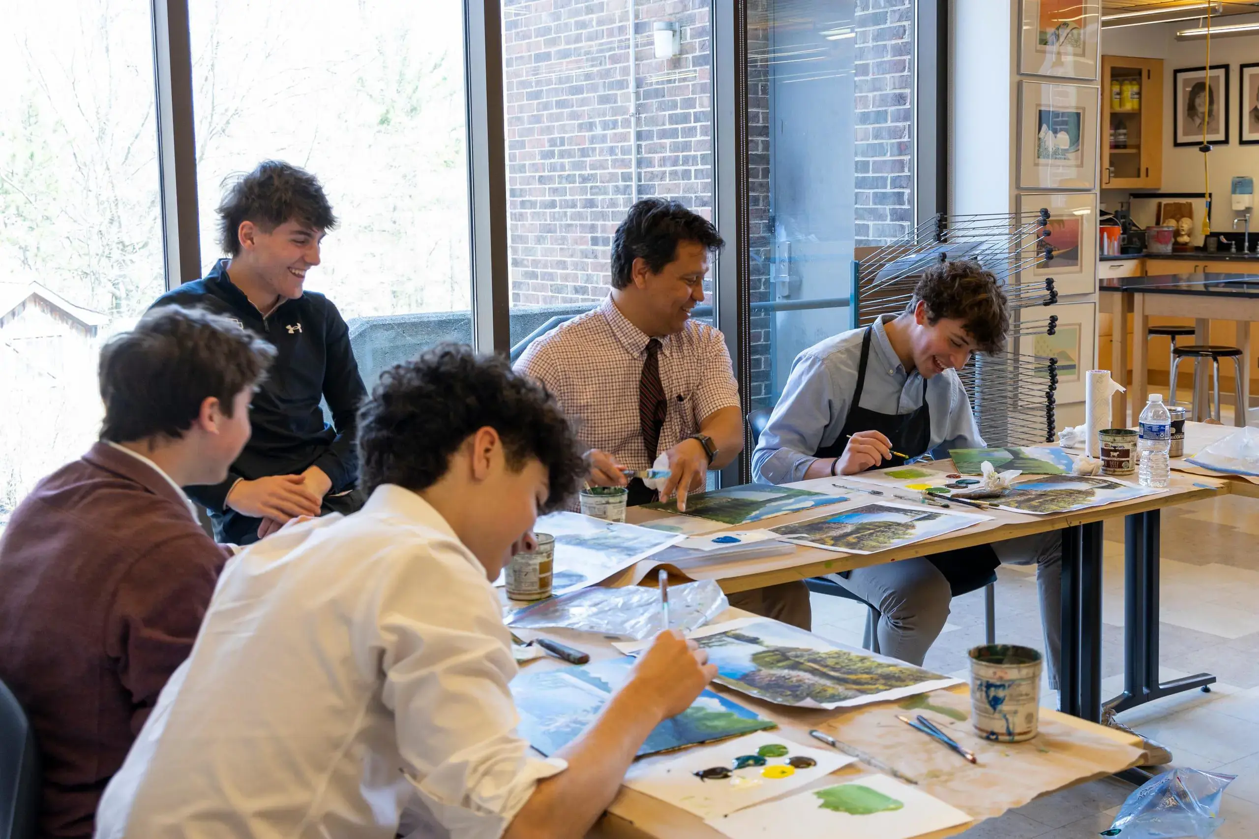 University School students painting landscapes.