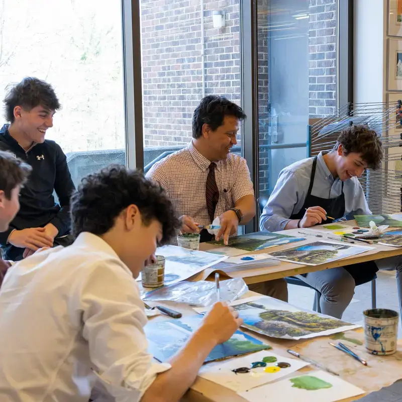 University School students painting landscapes.