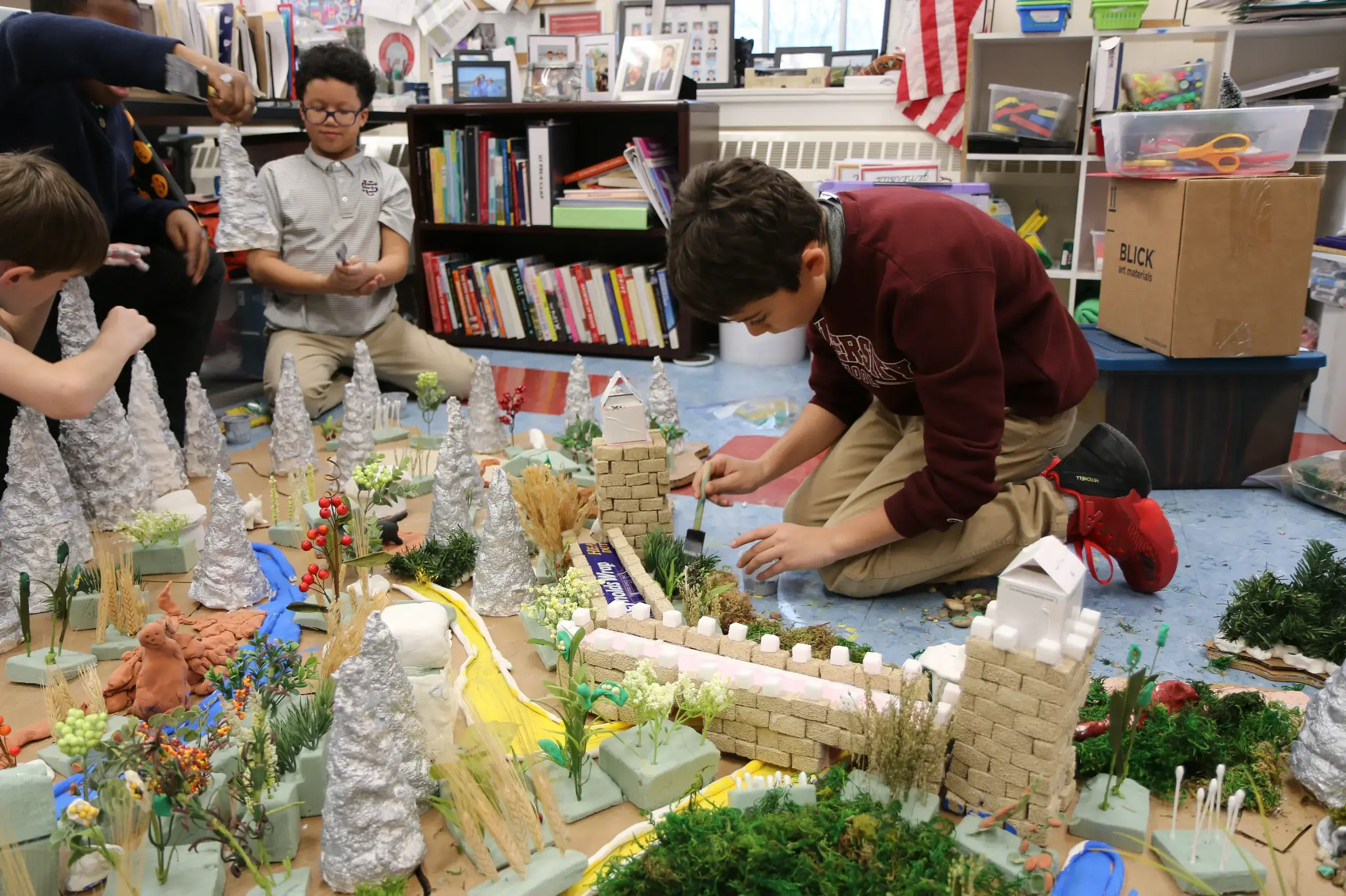 University School Fourth Grade Students building a model of The Great Wall of China.
