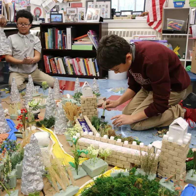 University School Fourth Grade Students building a model of The Great Wall of China.