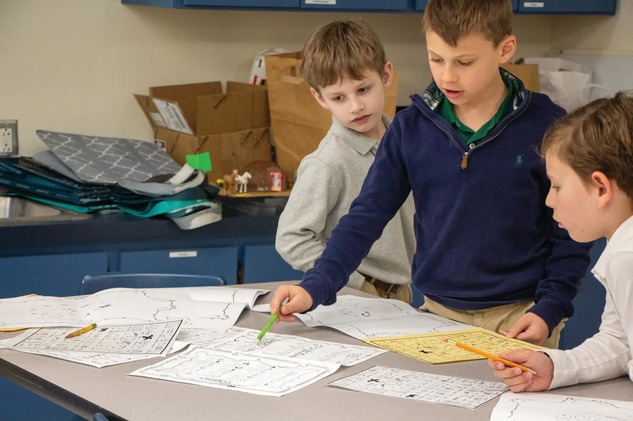 University School Third Grade students completing worksheets together in class.