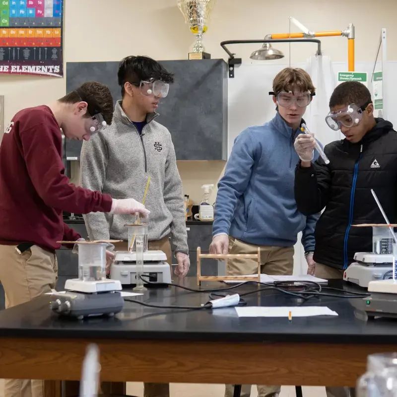 University School Middle School students conducting an experiment in a Science class.
