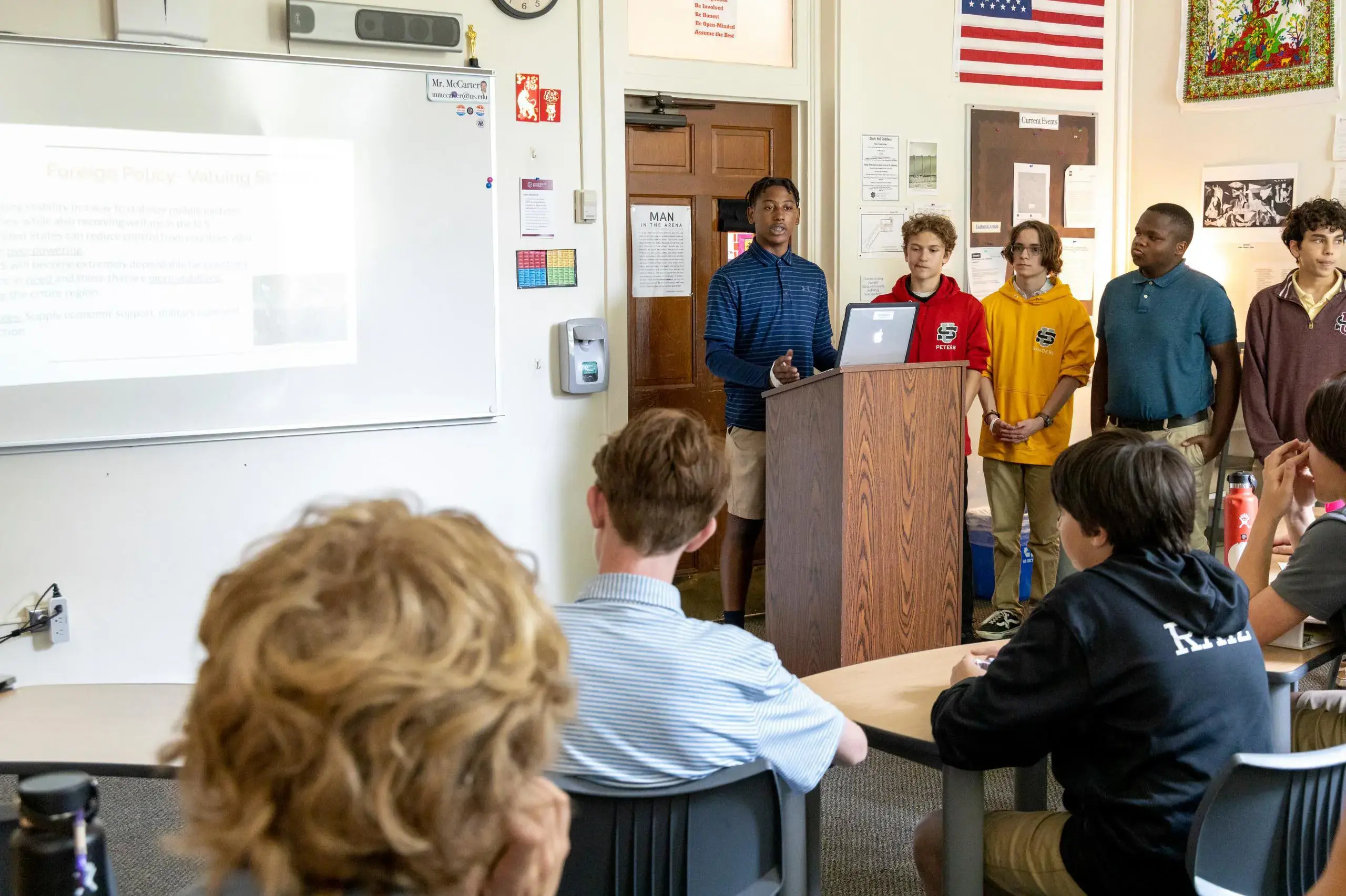 University School Middle School students giving a group presentation in a Social Studies lesson.
