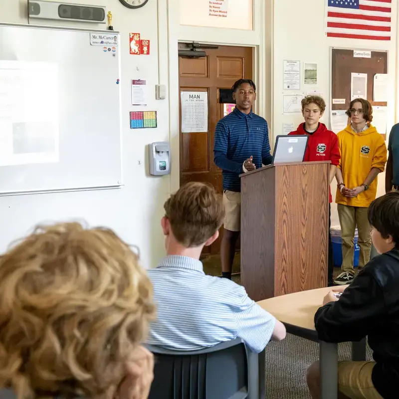 University School Middle School students giving a group presentation in a Social Studies lesson.