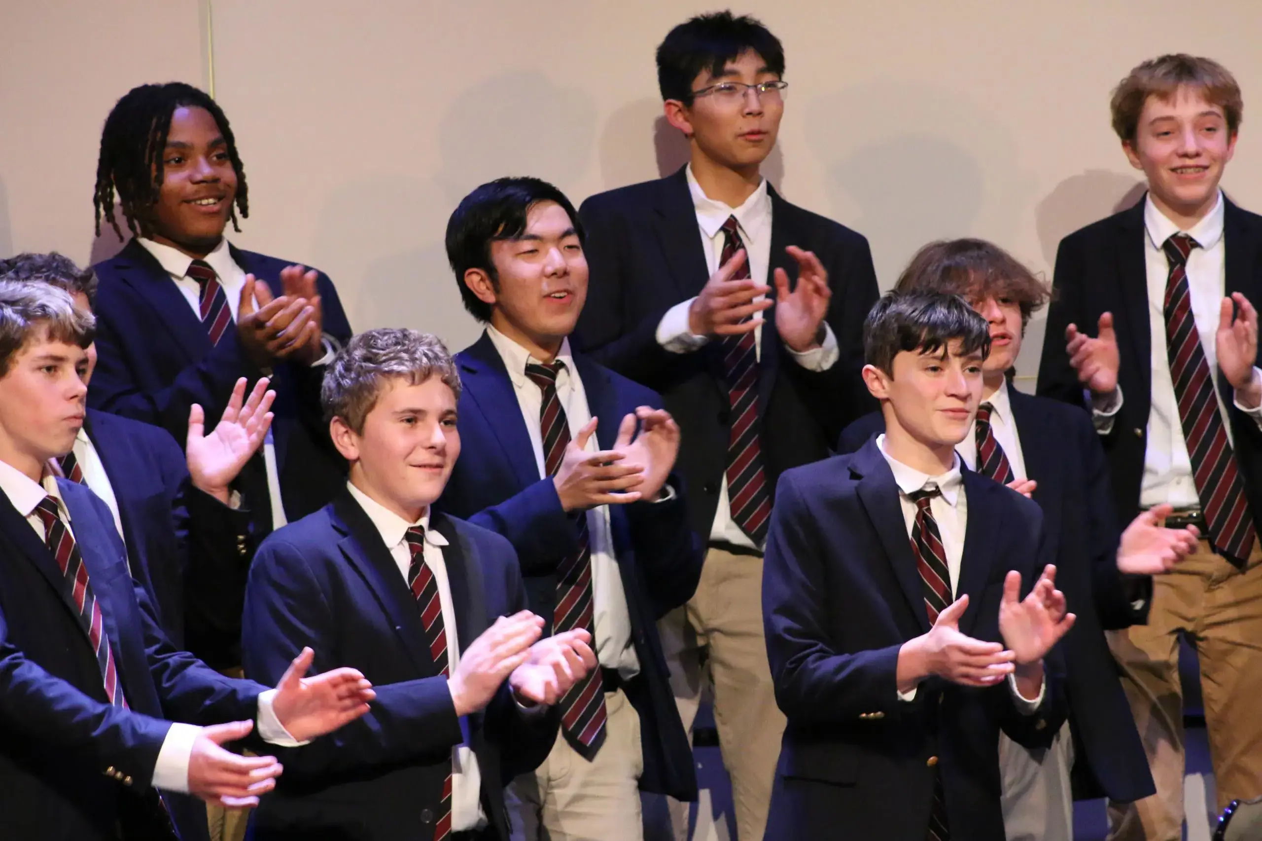 University School Upper School students applauding a performance.