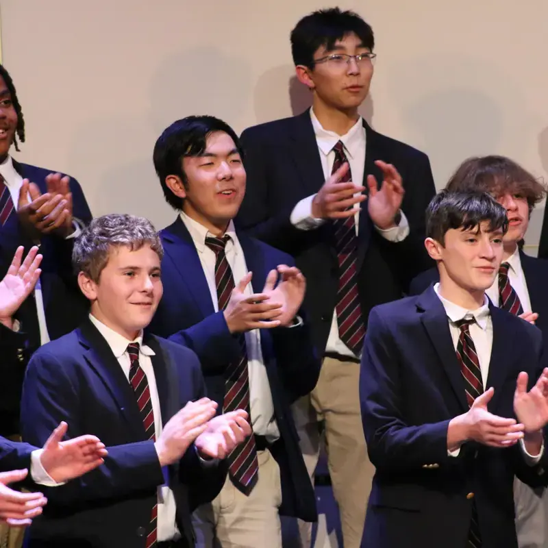 University School Upper School students applauding a performance.