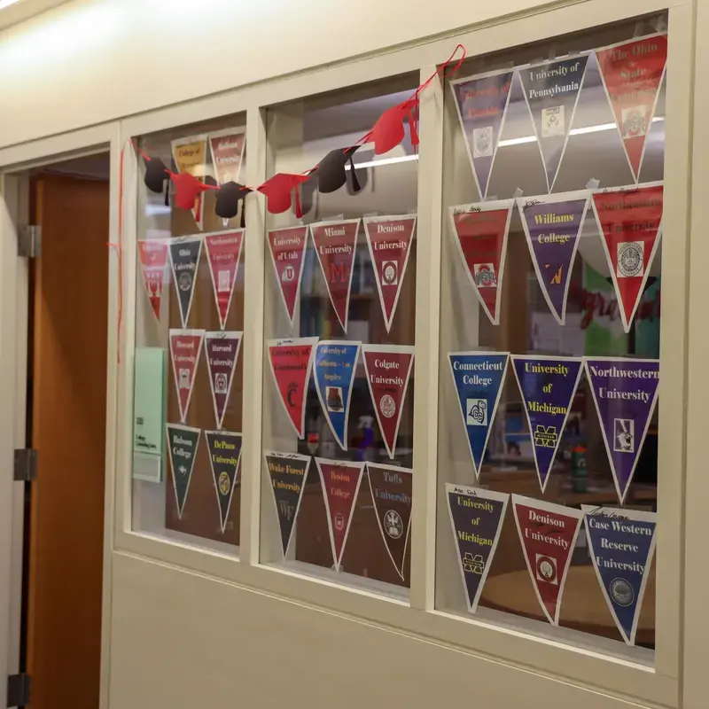 University School College Counseling department with college pennants and graduation cap bunting decorating the windows.