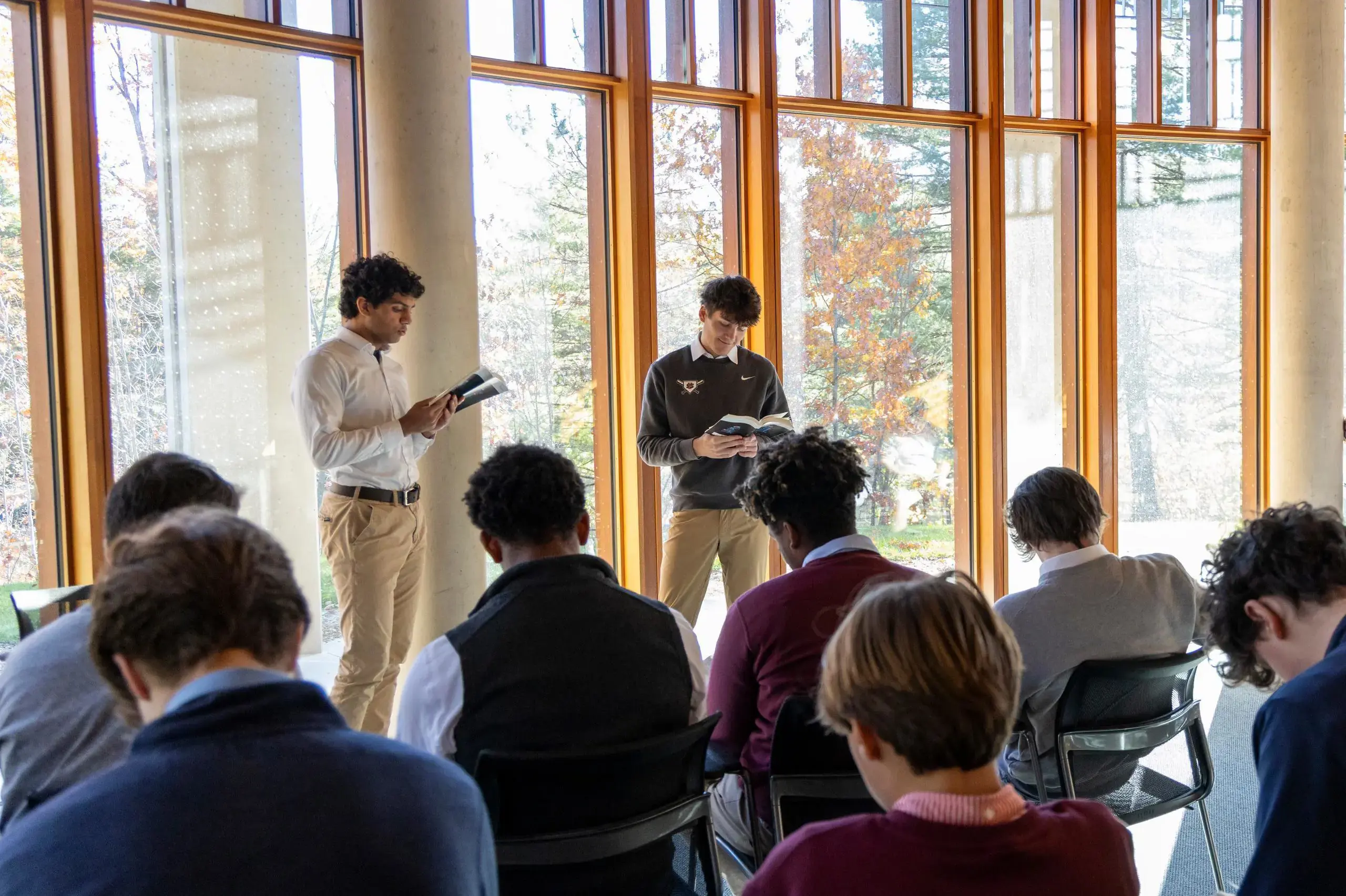 University School Upper School students reading in front of their class in an English lesson.