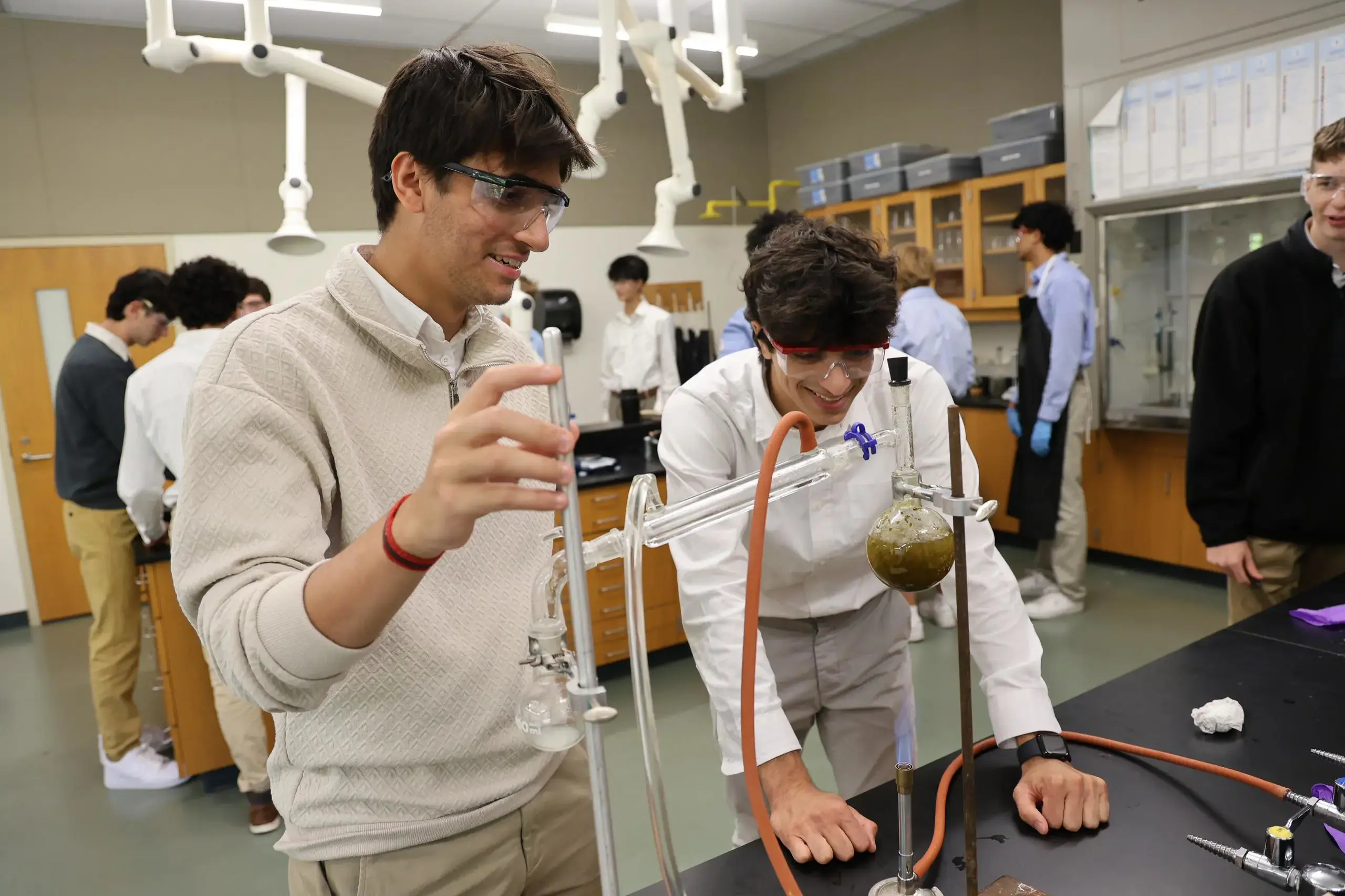 University School Upper School students conducting an experiment in a science class.